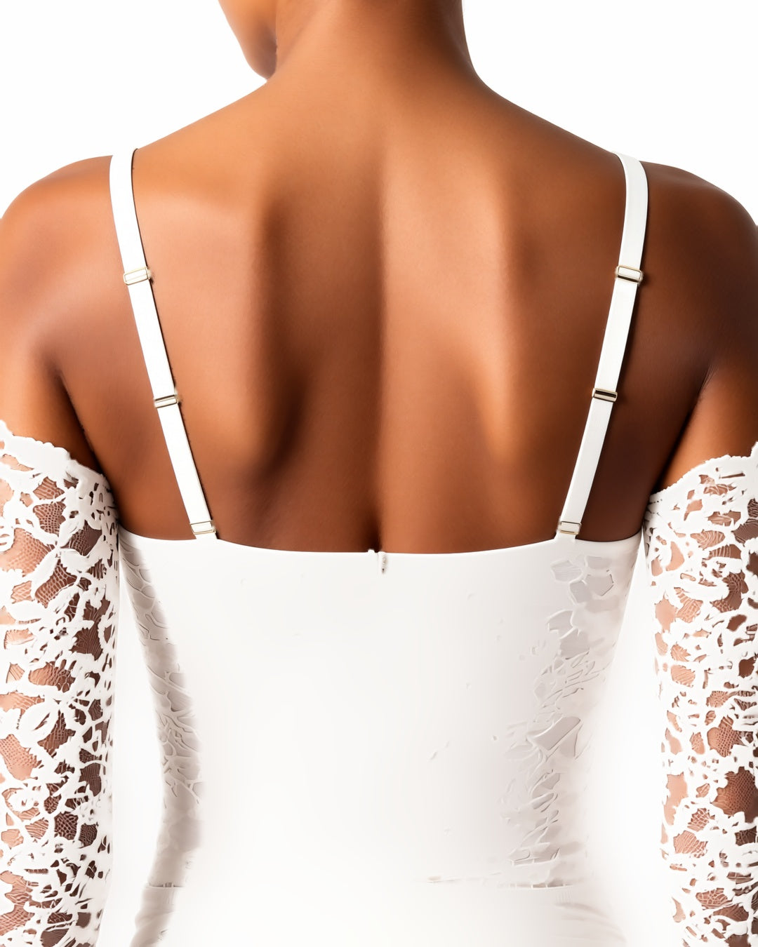 Rose Lace Long Sleeve Plunge Bodysuit in White, detail close-up of the back of the garment: the straps, band, neckline and fabric across the back. onmodel