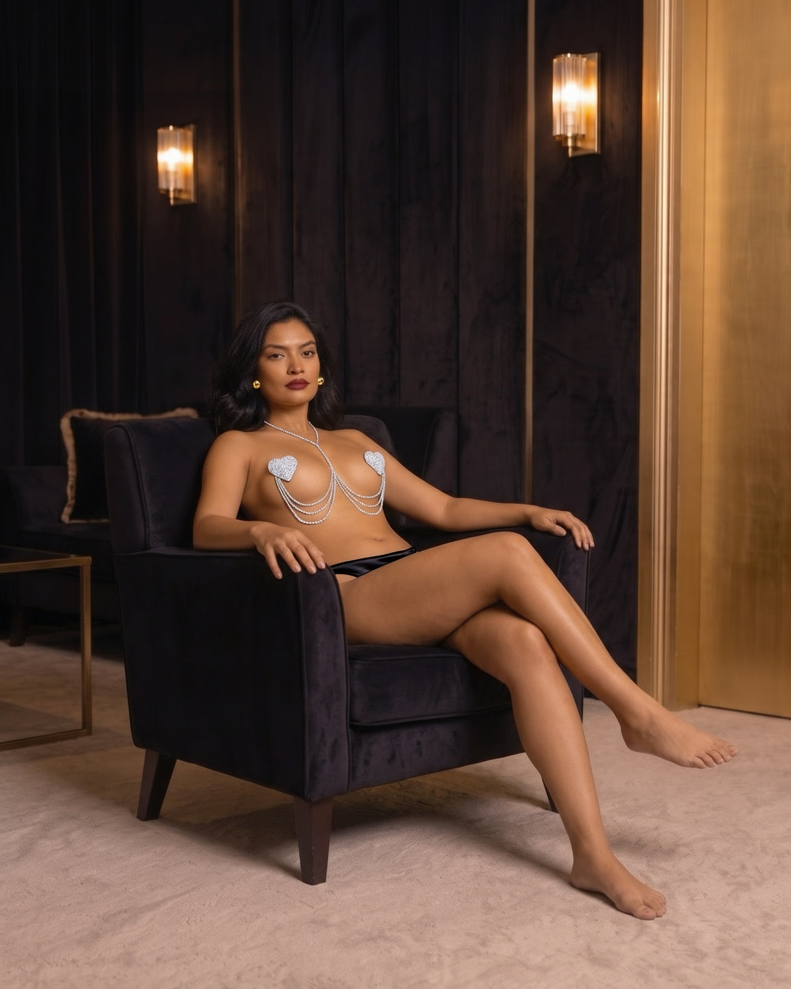 Rhinestone Heart Body Chain in Silver on model Salma (EUP-W02), seated in a velvet armchair. onmodel