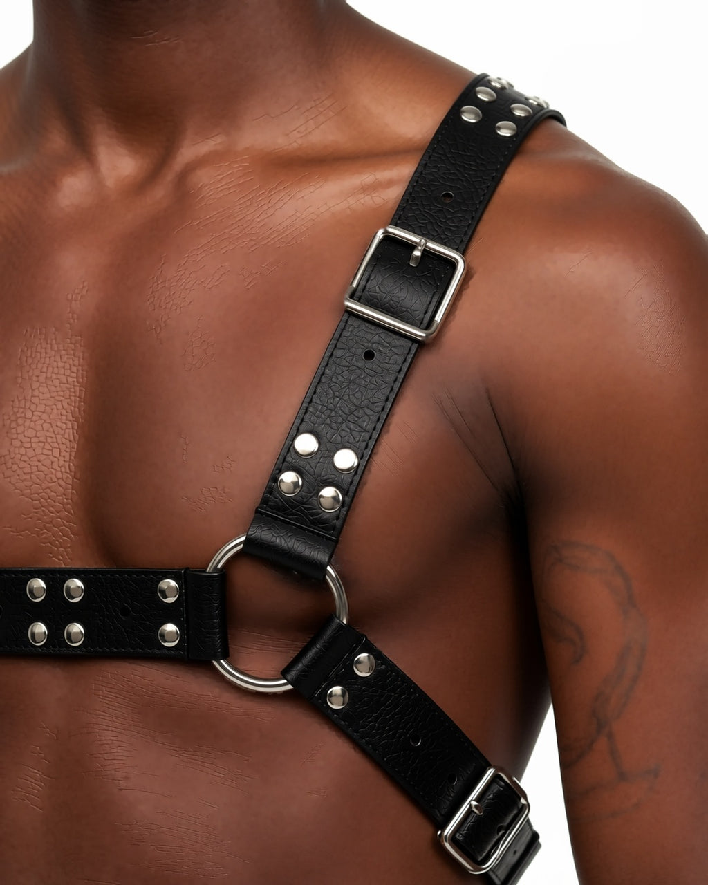 Gothic Chest Harness Body Strap, detail close-up of the studded chest band, the silver O-ring and the shoulder buckle. onmodel