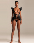 Faux Leather Harness Belt Skirt with Ruffle Hem in Black, front view on model Amira (EUP-W03). Pieces other than the harness are styling only.