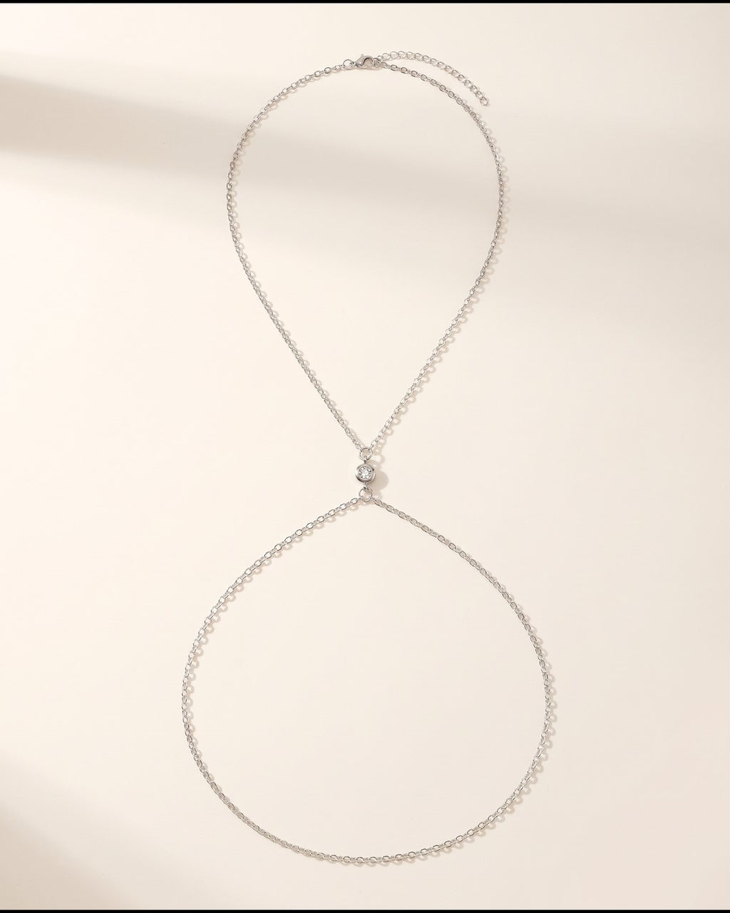 Silver Crystal Halter Body Chain laid flat to show the full piece.