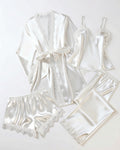 Four-Piece Satin Lace Pajama Set in White, laid flat to show the full piece.