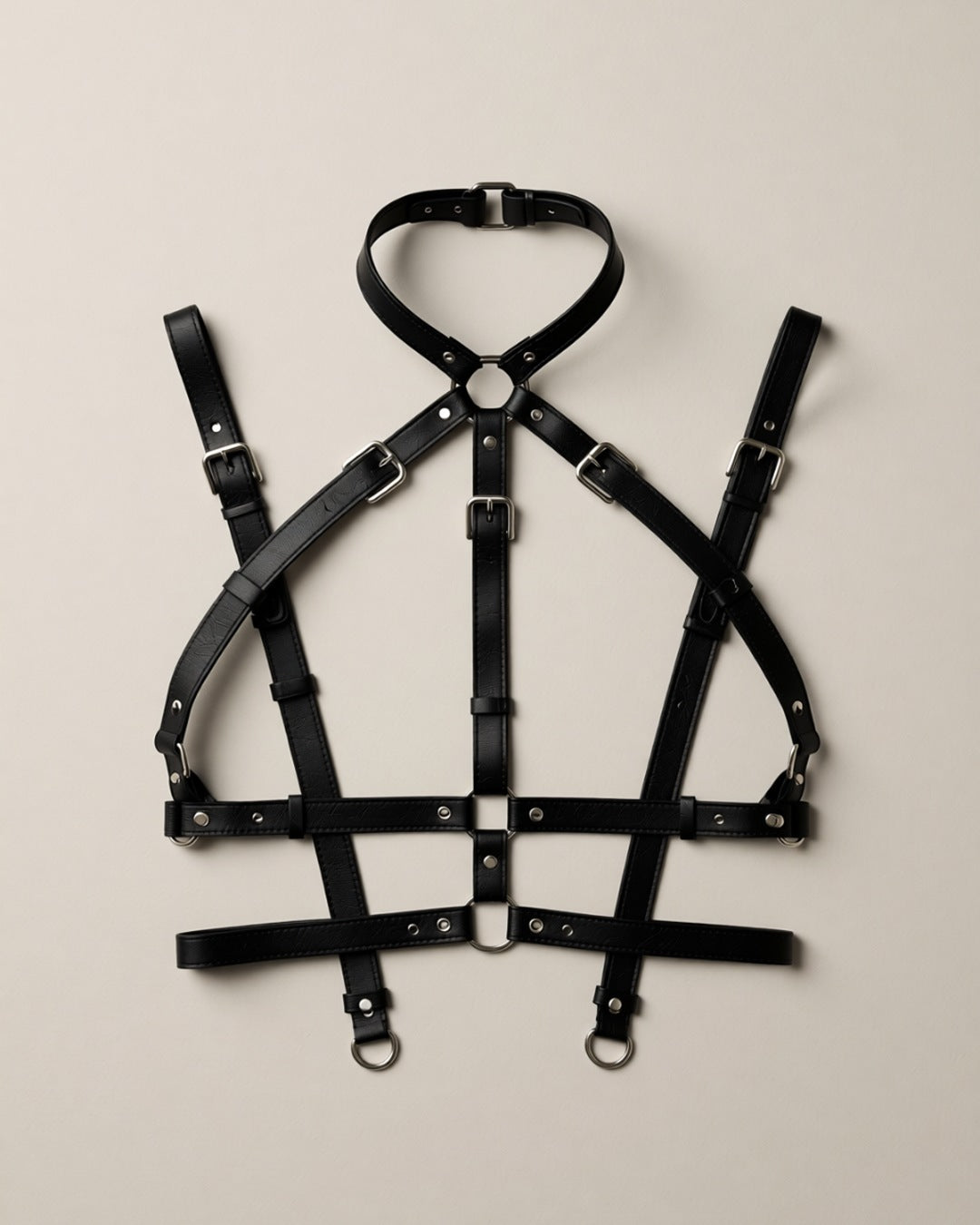 Faux Leather Chest Harness Suspender Belt, laid flat to show the full piece.