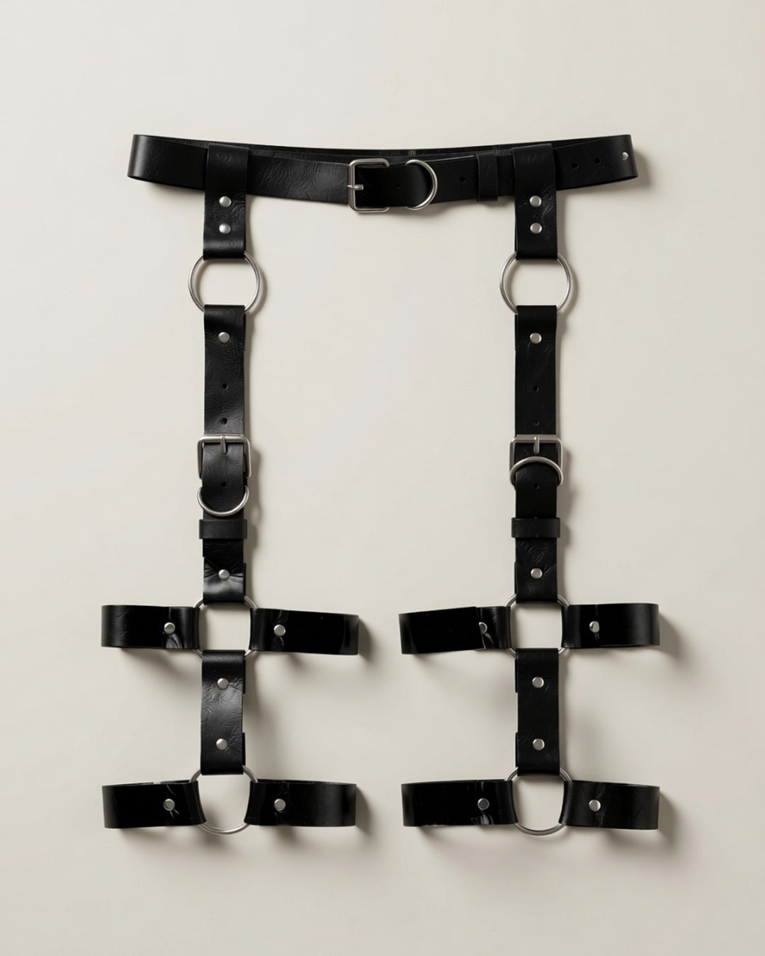 Faux Leather Thigh Harness Cage, laid flat to show the full piece.