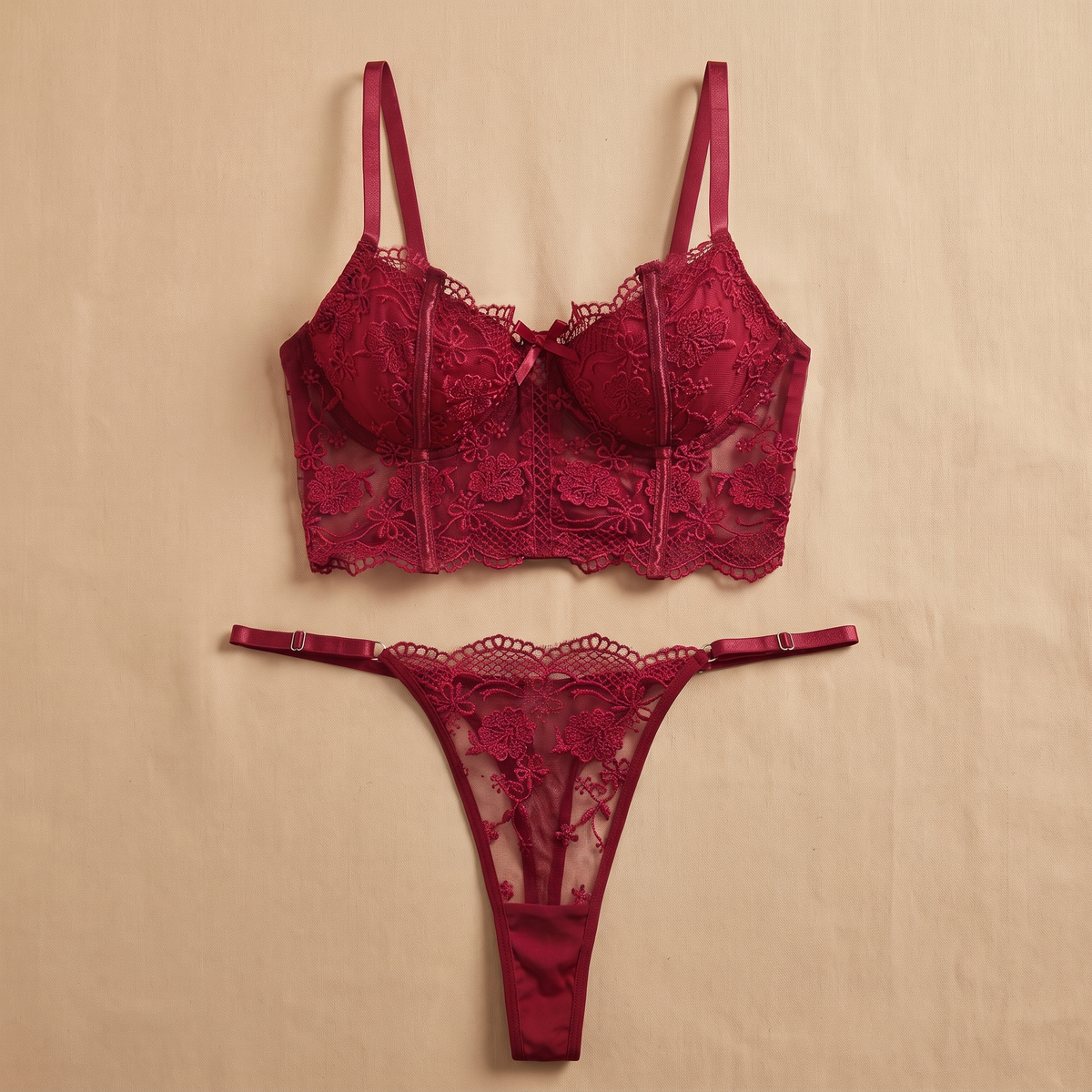 Burgundy lace longline bra and matching thong laid flat