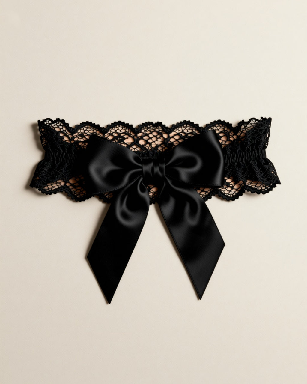 Lace Bow Leg Garter Ring, laid flat to show the full piece.