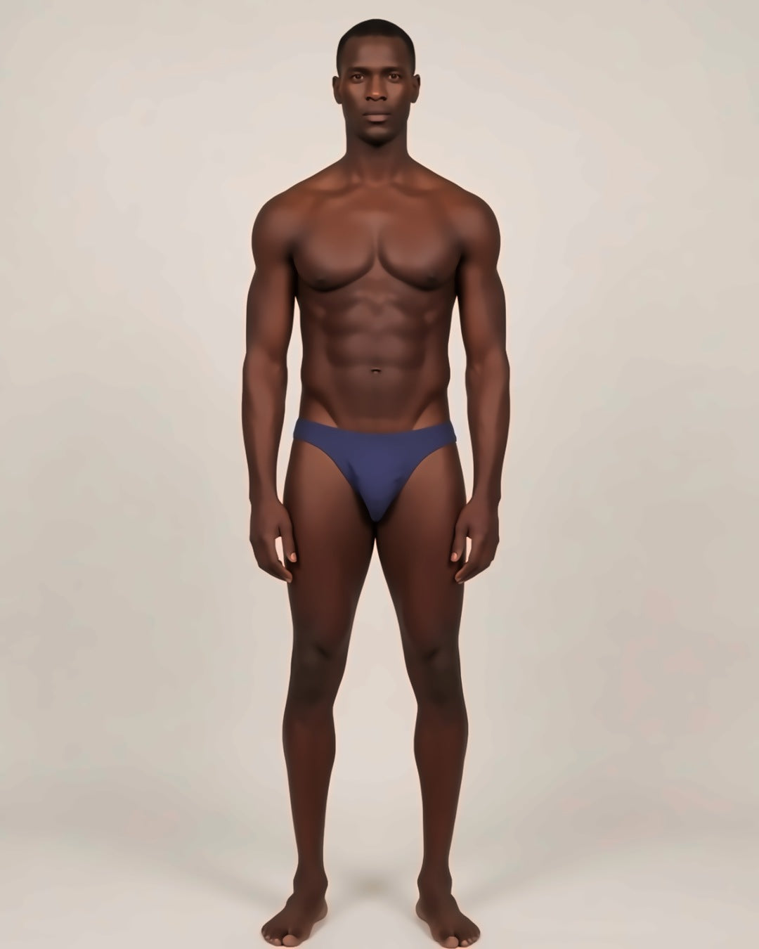 Men's Cheeky Low-Rise Bikini Briefs in navy, front view on a model.