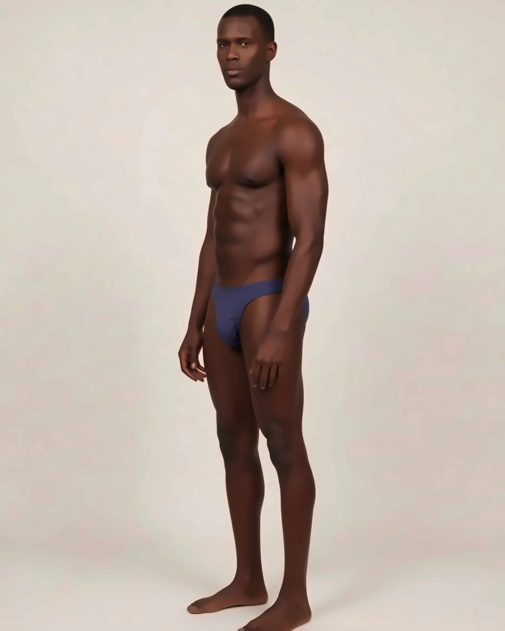 Men's Cheeky Low-Rise Bikini Briefs in navy, three-quarter view on a model.