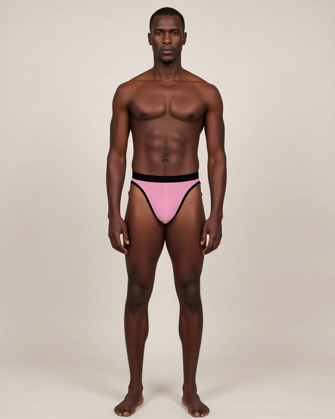 Men's Soft U-Pouch Briefs in pink, front view on a model.