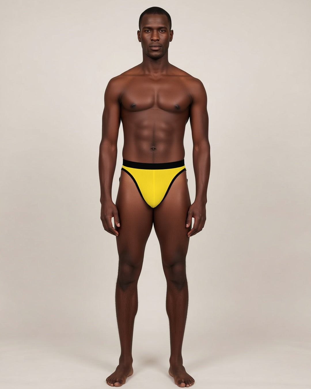 Men's Soft U-Pouch Briefs in yellow, front view on a model.