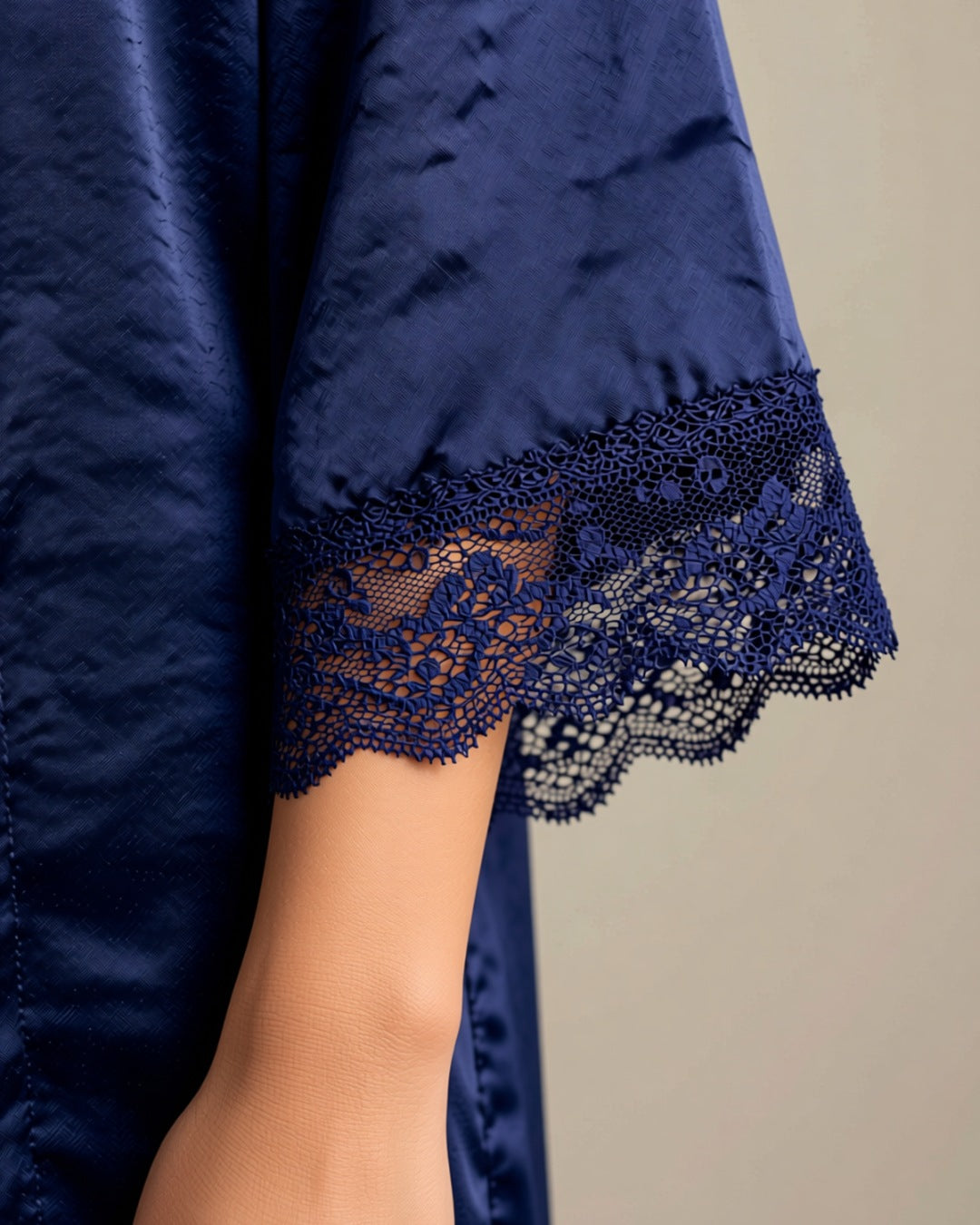 Navy Satin Robe with Lace Trim, detail close-up of the navy lace cuff on the wide satin sleeve.